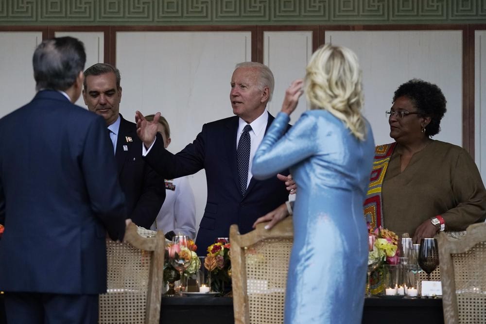 President Joe Biden speaks with guests as he and first lady Jill Biden host a dinner during the Summit of the Americas, Thursday, June 9, 2022, in Los Angeles. (AP Photo/Evan Vucci)